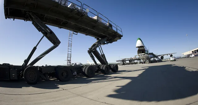 A ramp team of the 60th Aerial Port Squadron worked quickly to fill the 42 pallet positions in the contract air cargo jet from Evergreen's green and white 747 Freighter on April 18 at Travis Air Force Base, Calif. Tunner features powered deck conveyors for moving cargo, 180¡ wheel rotation to reduce. Comparing ramp time with agreed readiness standards